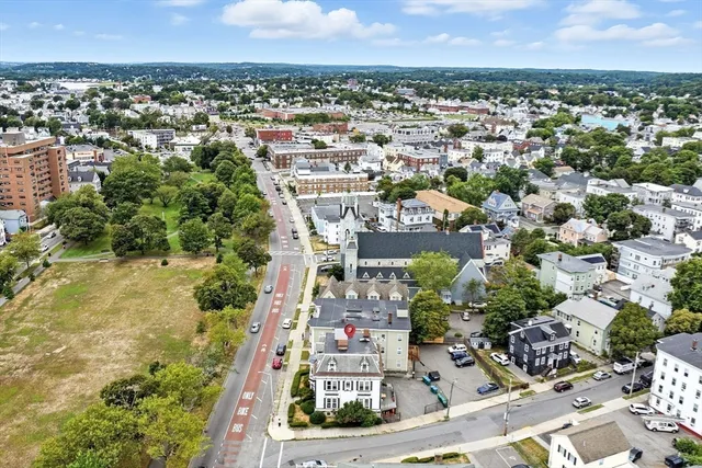 an aerial view of residential houses with outdoor space