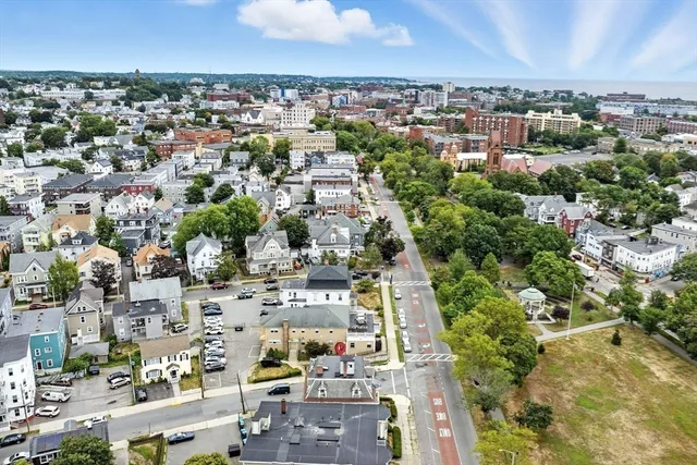 an aerial view of residential houses with outdoor space