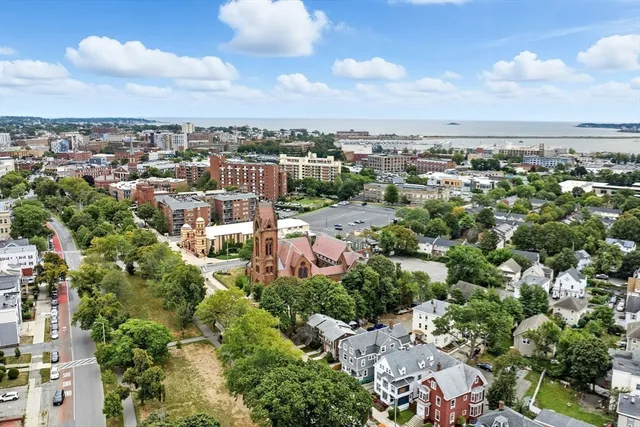 an aerial view of residential building with green space