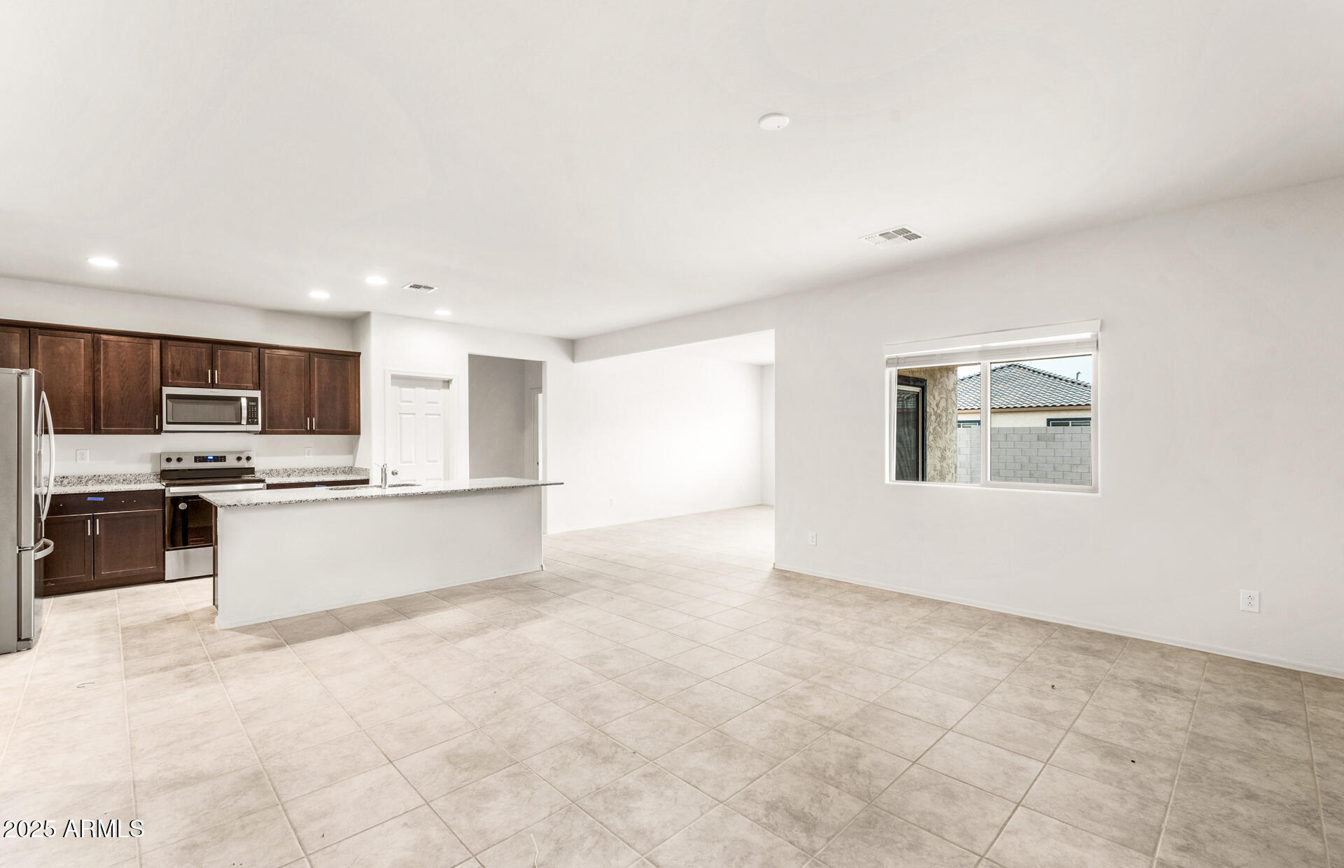 25480 West Chipman Road Buckeye, AZ 85326 - Photo 10 of 24 8 - Gathering Room and Kitchen