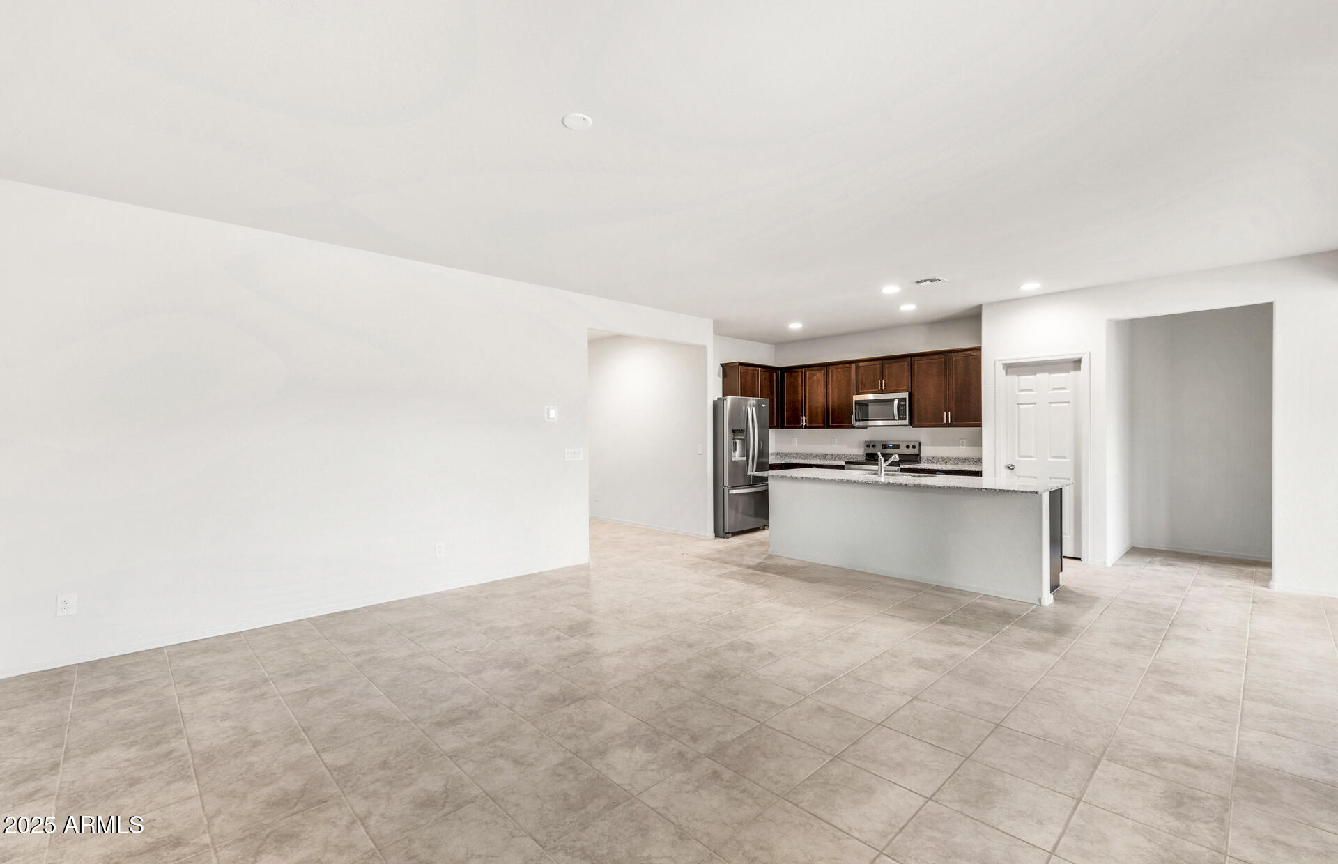 25480 West Chipman Road Buckeye, AZ 85326 - Photo 12 of 24 10 - Gathering Room and Kitchen