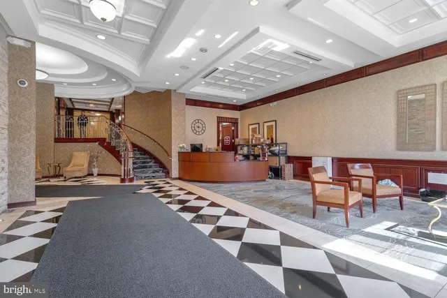 a view of a livingroom with furniture and a ceiling fan
