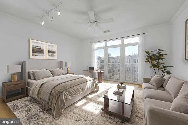 a bedroom with a large bed and a couch