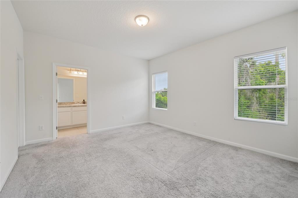 2352 Litchfield Loop DeLand, FL 32720 - Photo 13 of 24 an empty room with windows and mirror