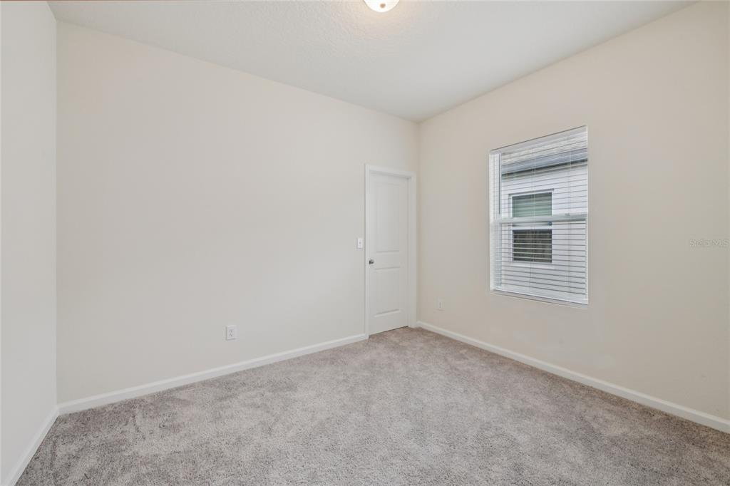 2352 Litchfield Loop DeLand, FL 32720 - Photo 16 of 24 a view of an empty room with a window
