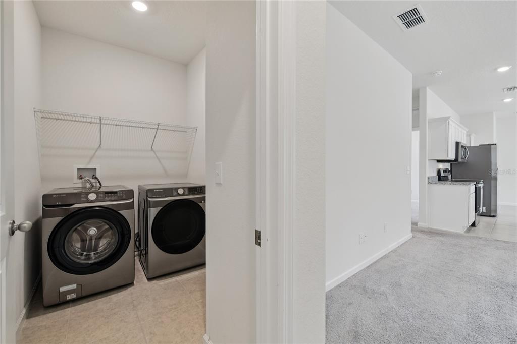 2352 Litchfield Loop DeLand, FL 32720 - Photo 18 of 24 a utility room with dryer and washer