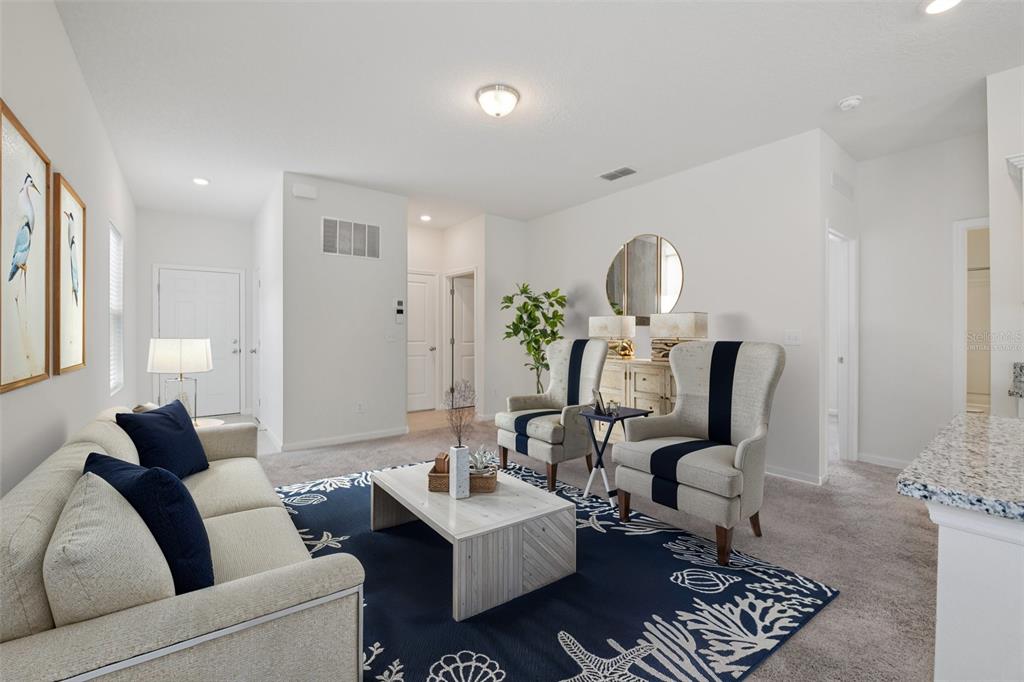 2352 Litchfield Loop DeLand, FL 32720 - Photo 3 of 24 a living room with furniture and a mirror