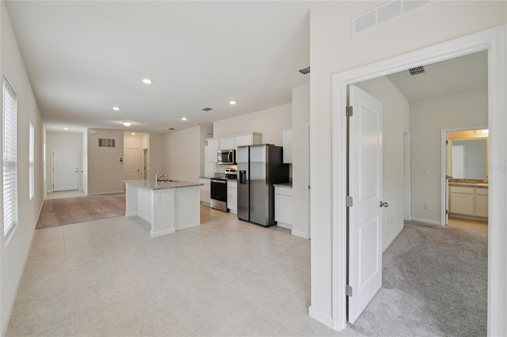 2352 Litchfield Loop DeLand, FL 32720 - Photo 10 of 24 a view of a kitchen with refrigerator and a sink