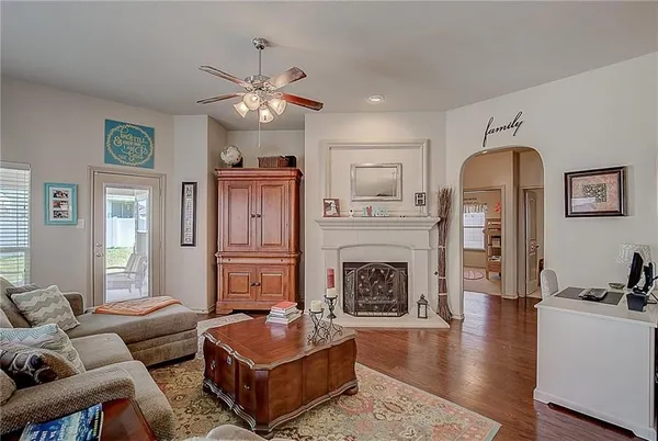 a living room with furniture and a fireplace