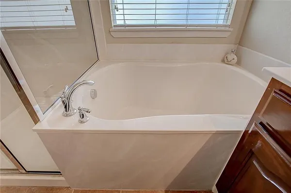 a white bath tub sitting in a bathroom