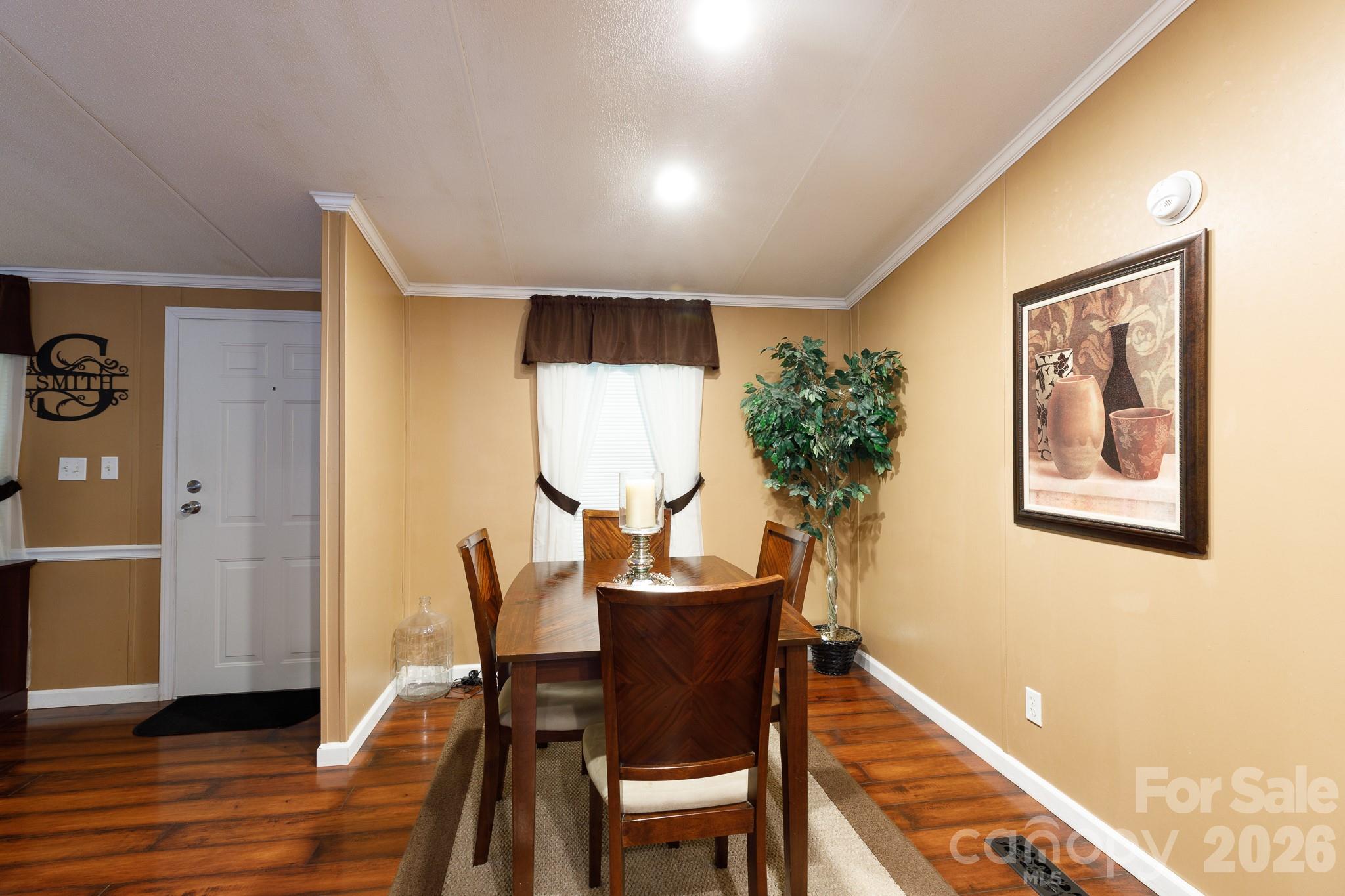 652 Sutton Spring Road York, SC 29745 - Photo 7 of 28 a dining room with furniture and wooden floor