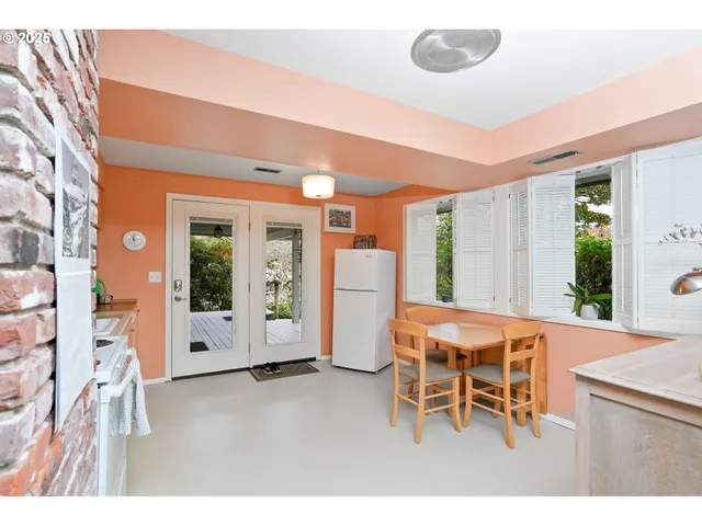 a kitchen that has a lot of cabinets a sink and a stove in it