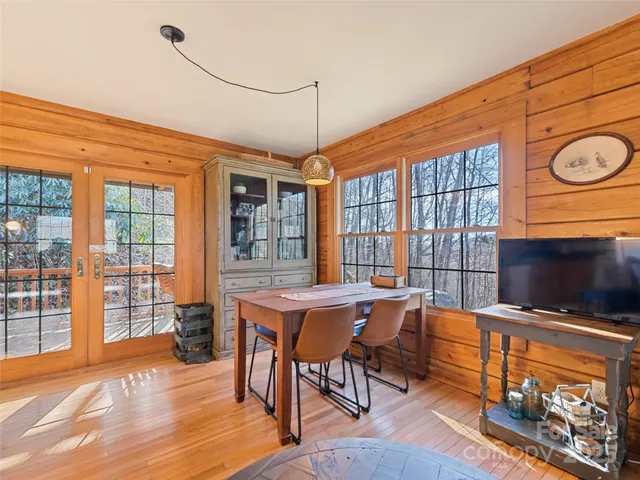 a dining room with a table and chairs
