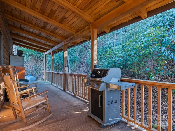 a view of a balcony with wooden floor