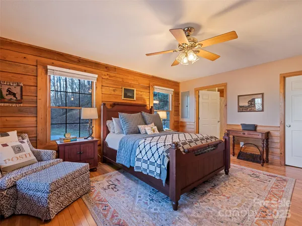 a bedroom with a bed and a dresser in it
