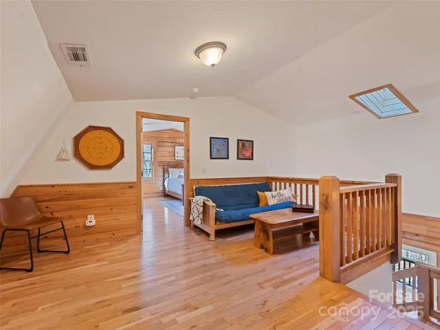 a view of room with window and wooden floor