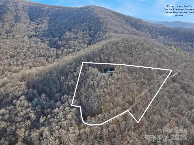 a view of a house with backyard and chairs