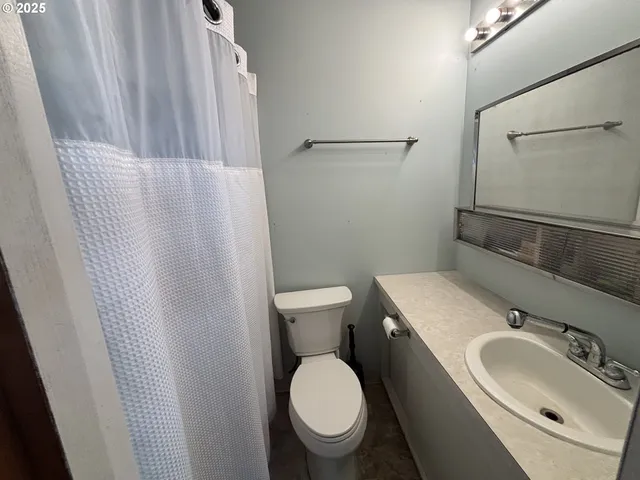 a bathroom with a sink and a toilet