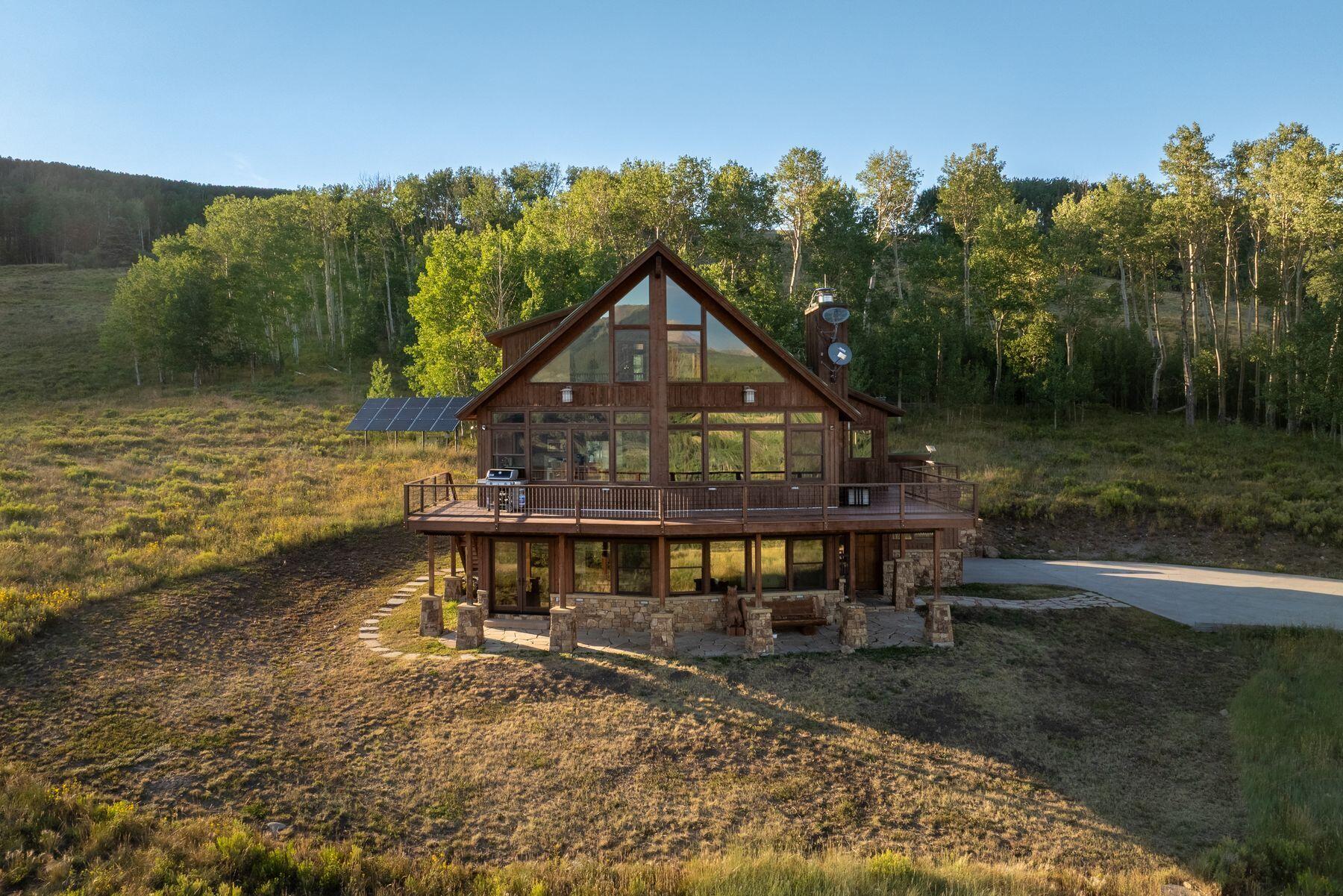 1678 Little Cone Ranch Road Placerville, CO 81430 - Photo 5 of 35 a view of a house with a yard