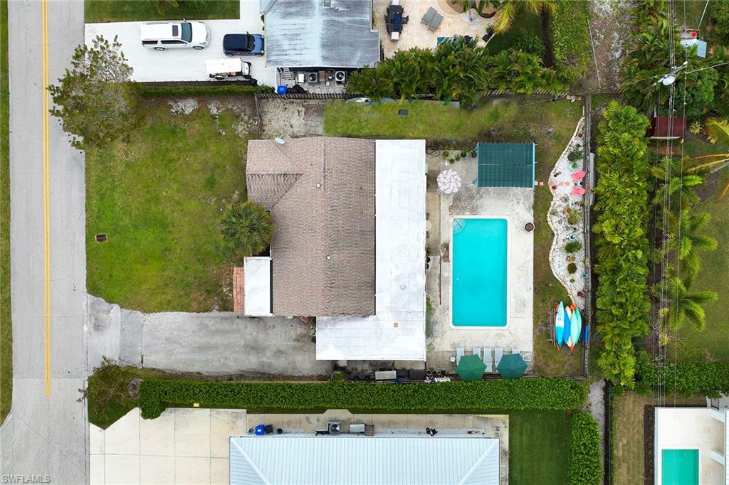 1343 12th Street North Naples, FL 34102 - Photo 16 of 18 an aerial view of residential houses with outdoor space and parking