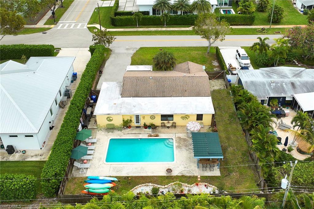 1343 12th Street North Naples, FL 34102 - Photo 18 of 18 an aerial view of a house with a swimming pool yard and outdoor seating