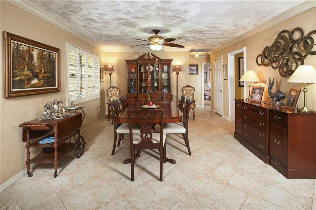 1343 12th Street North Naples, FL 34102 - Photo 3 of 18 a view of a dining room with furniture