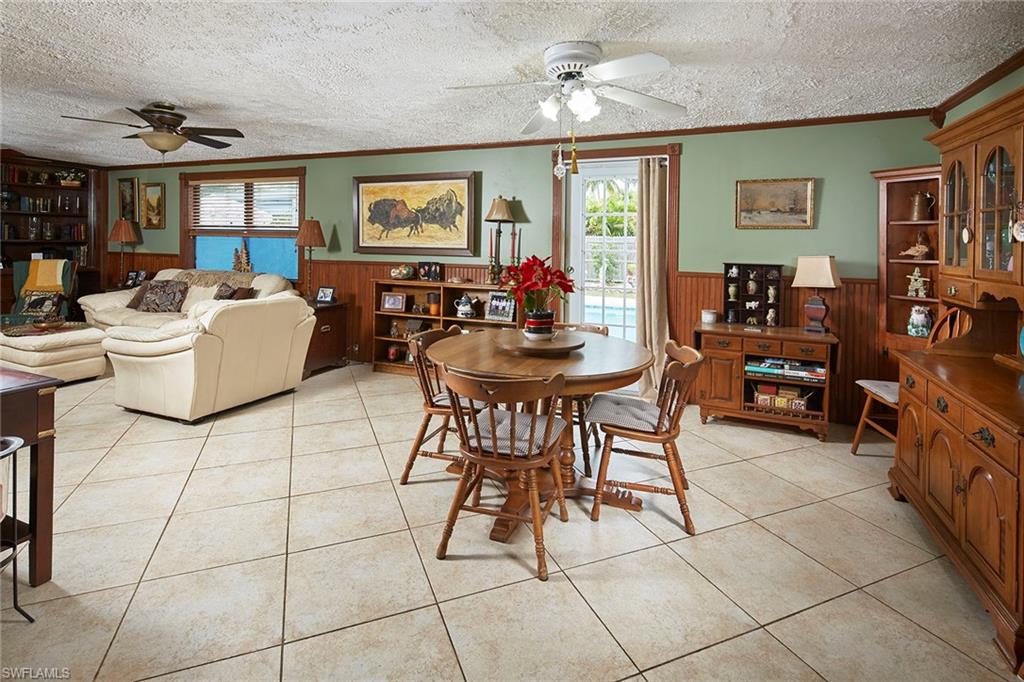 1343 12th Street North Naples, FL 34102 - Photo 5 of 18 a living room with patio furniture and a window
