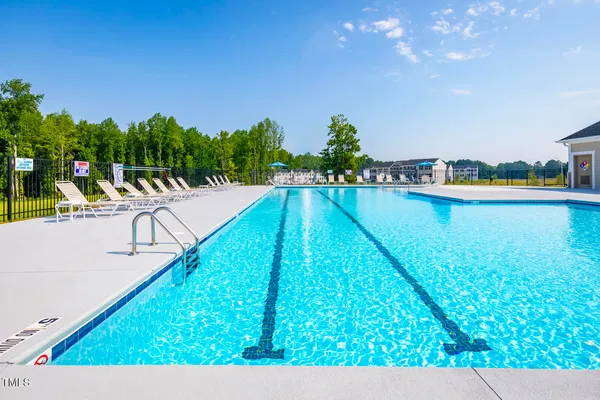 a view of swimming pool with a outdoor seating