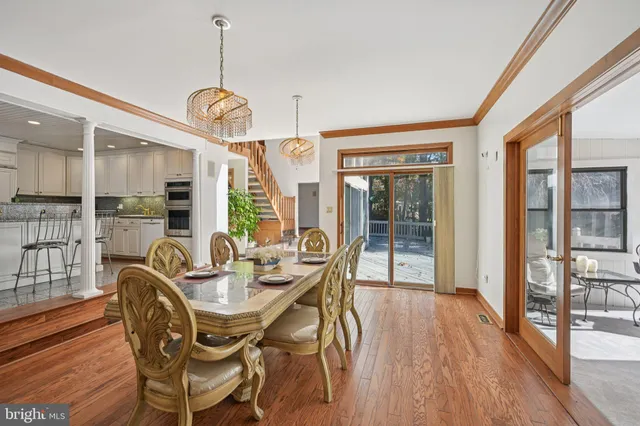 a living room with furniture ceiling fan and a window