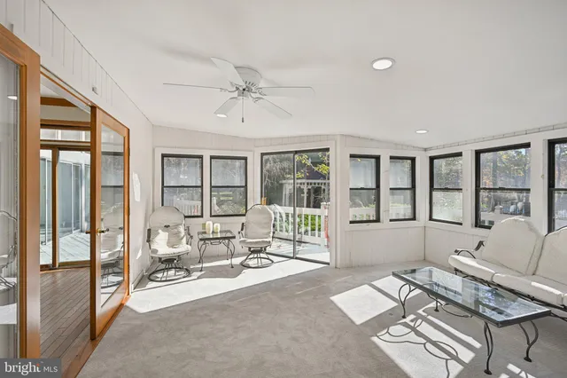 a view of staircase with lots of windows and wooden floor