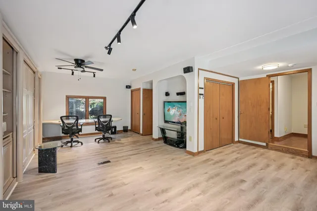 a bathroom with a toilet a sink and a mirror