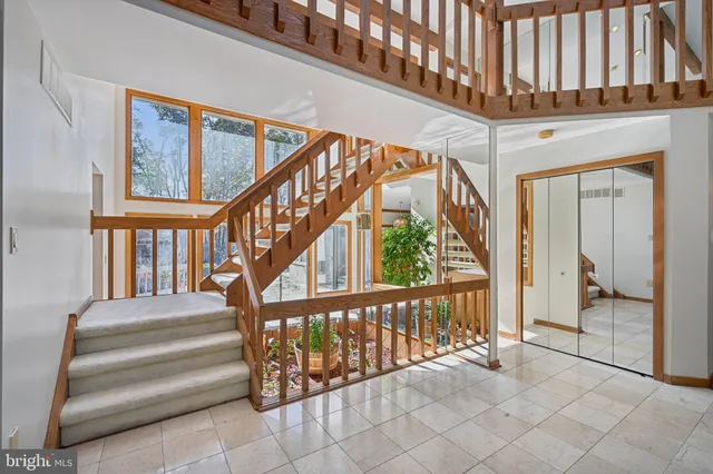 a view of an entryway with wooden floor