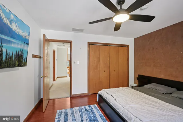a spacious bathroom with a tub sink and mirror