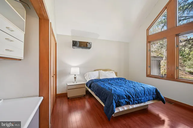 a view of a kitchen with granite countertop stainless steel appliances and a chandelier