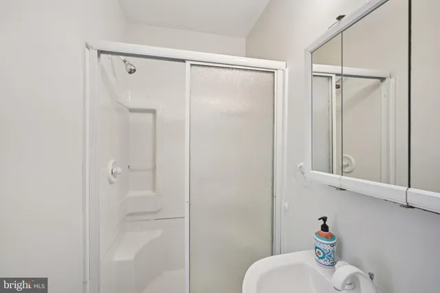 a bathroom with a shower and a toilet