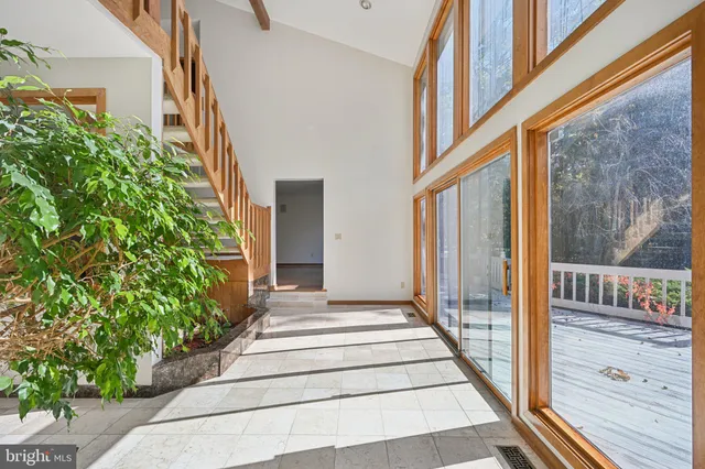 a kitchen with stainless steel appliances granite countertop a stove a sink a microwave and a refrigerator