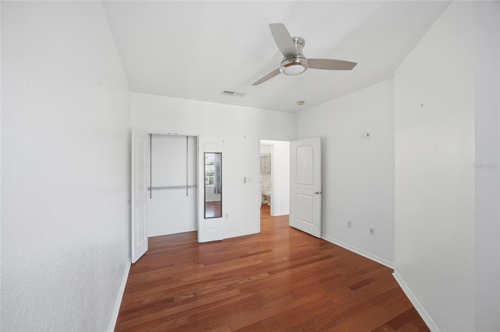 4221 West Spruce Street, Unit 2328 Tampa, FL 33607 - Photo 19 of 40 a view of empty room with wooden floor