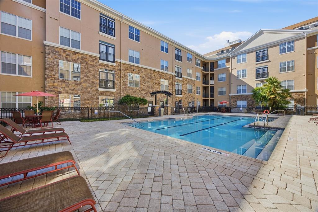 4221 West Spruce Street, Unit 2328 Tampa, FL 33607 - Photo 25 of 40 a view of a building with many windows