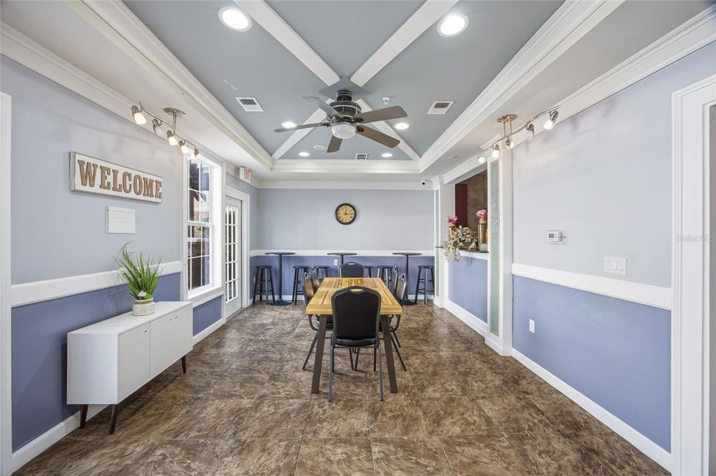 4221 West Spruce Street, Unit 2328 Tampa, FL 33607 - Photo 30 of 40 a living room with furniture and a chandelier