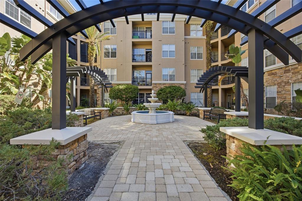 4221 West Spruce Street, Unit 2328 Tampa, FL 33607 - Photo 4 of 40 a view of a building with a porch