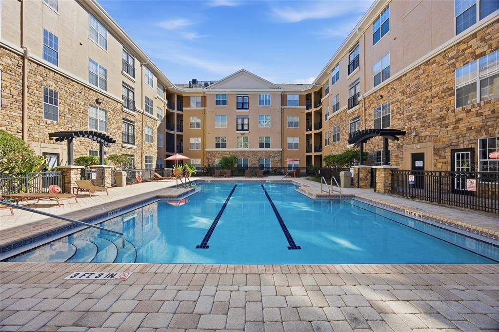 4221 West Spruce Street, Unit 2328 Tampa, FL 33607 - Photo 4 of 40 a view of a building with sitting area