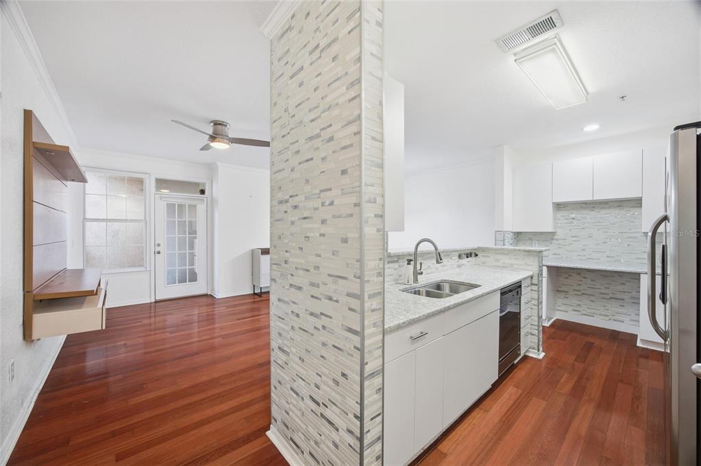 4221 West Spruce Street, Unit 2328 Tampa, FL 33607 - Photo 7 of 40 a spacious bathroom with a granite countertop sink a toilet a large mirror and shower