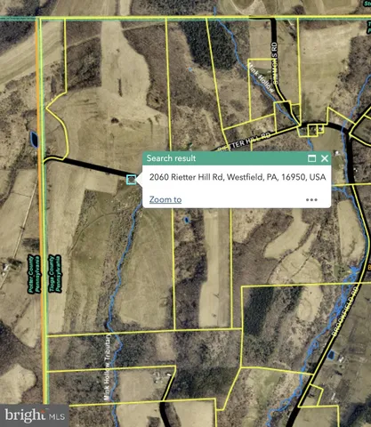 a picture of a bathroom with a shower