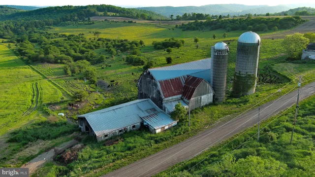 a view of a lake with a garden and outdoor seating