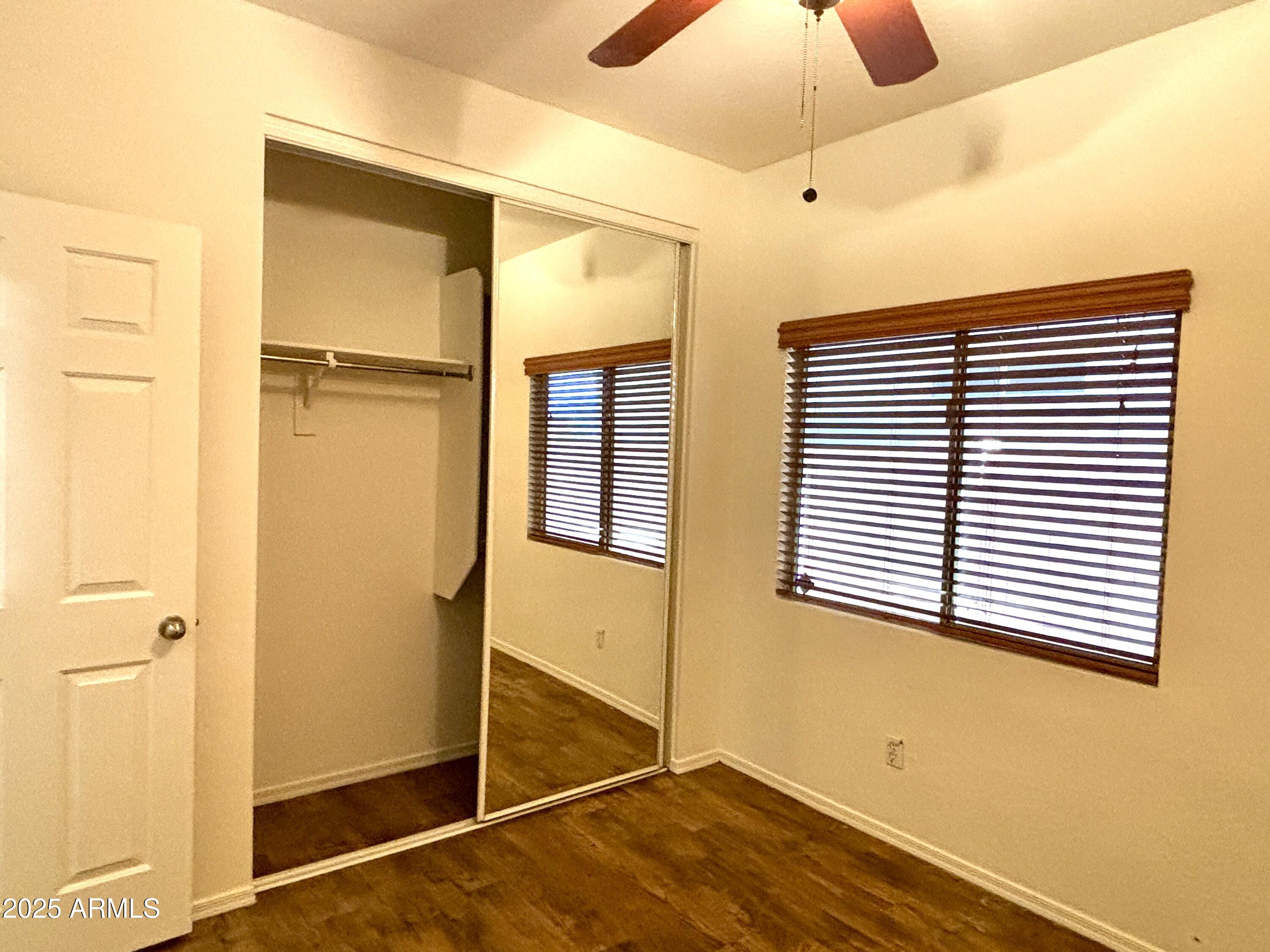 5139 West Maldonado Road Laveen, AZ 85339 - Photo 21 of 39 a view of a room with a window and wooden floor