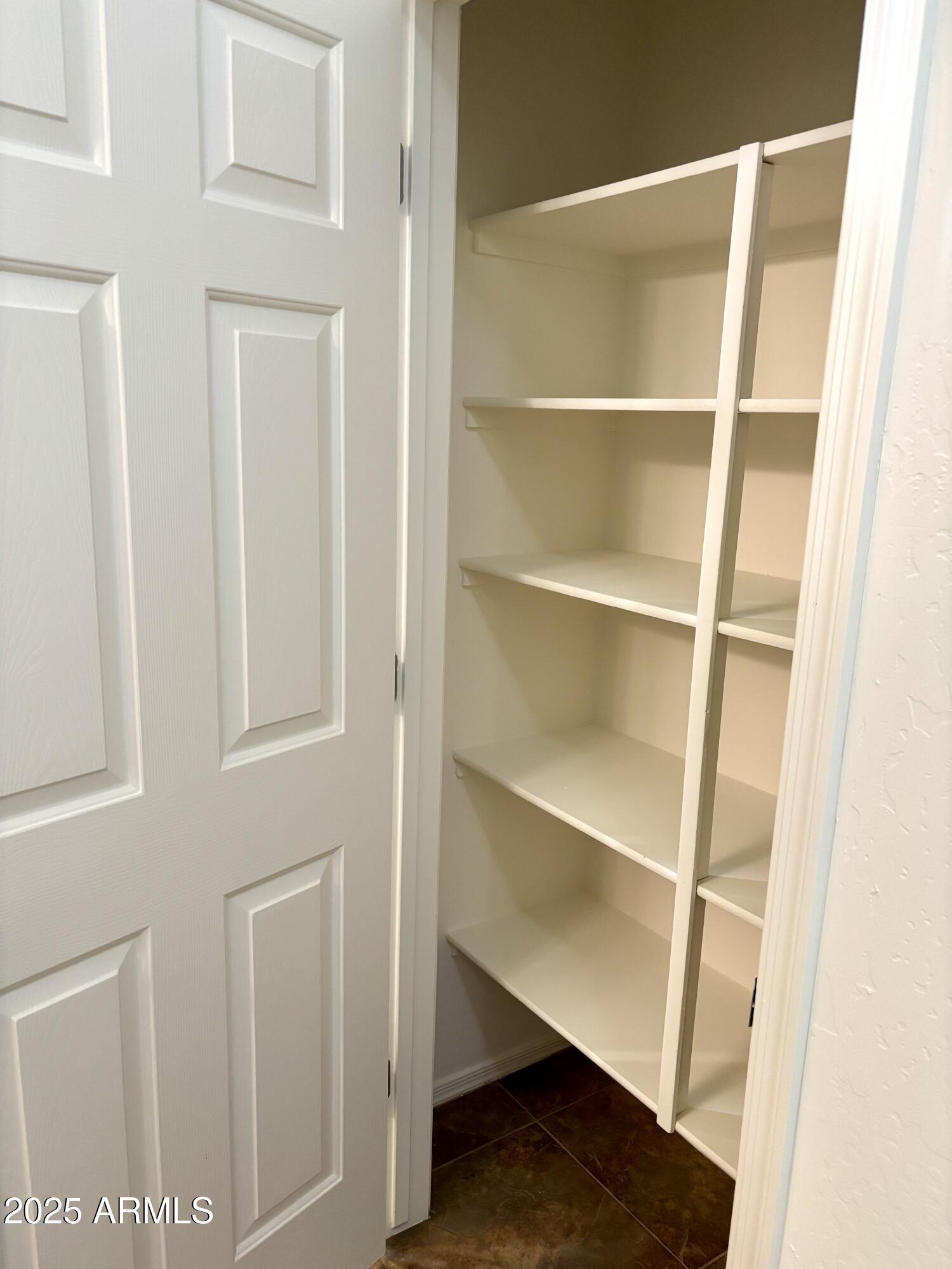 5139 West Maldonado Road Laveen, AZ 85339 - Photo 23 of 39 a view of an empty walk in closet