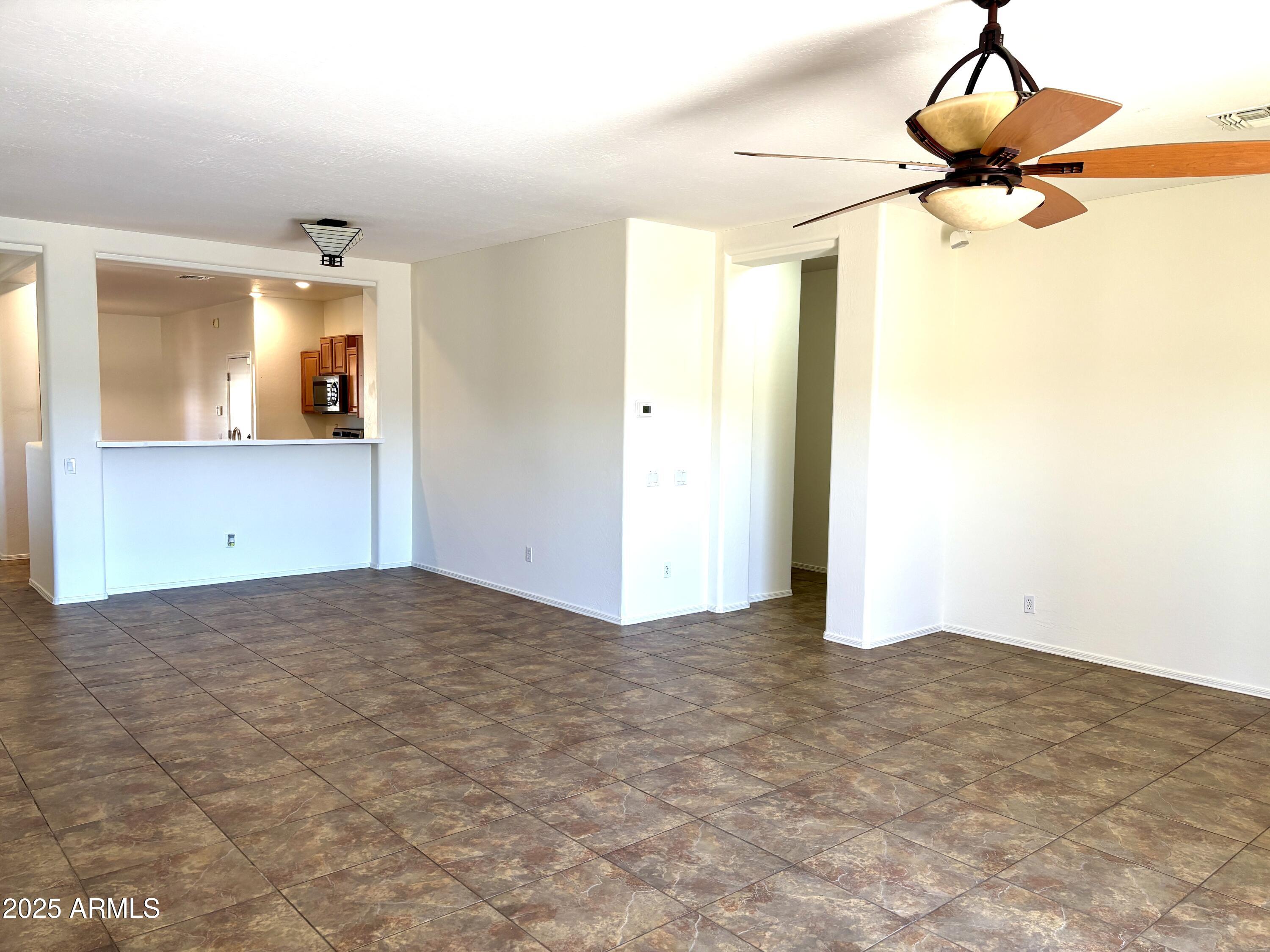 5139 West Maldonado Road Laveen, AZ 85339 - Photo 6 of 39 a view of a room with cabinet and mirrors