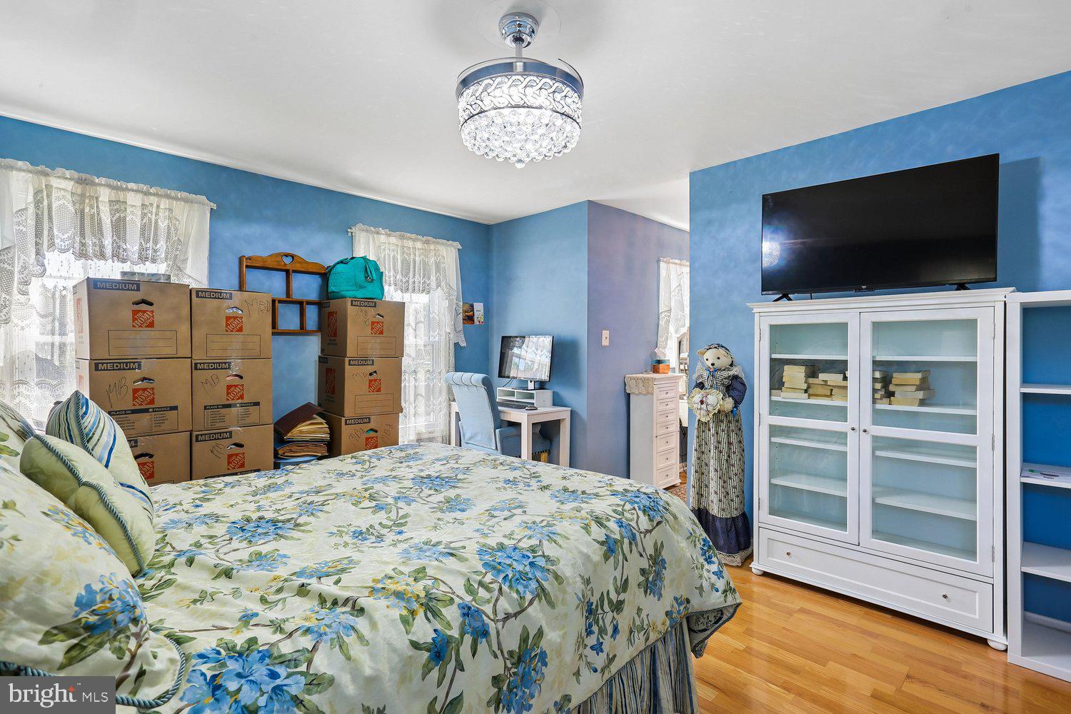 14822 Rose Trellis Place Silver Spring, MD 20906 - Photo 24 of 65 a bedroom with a bed and a flat screen tv