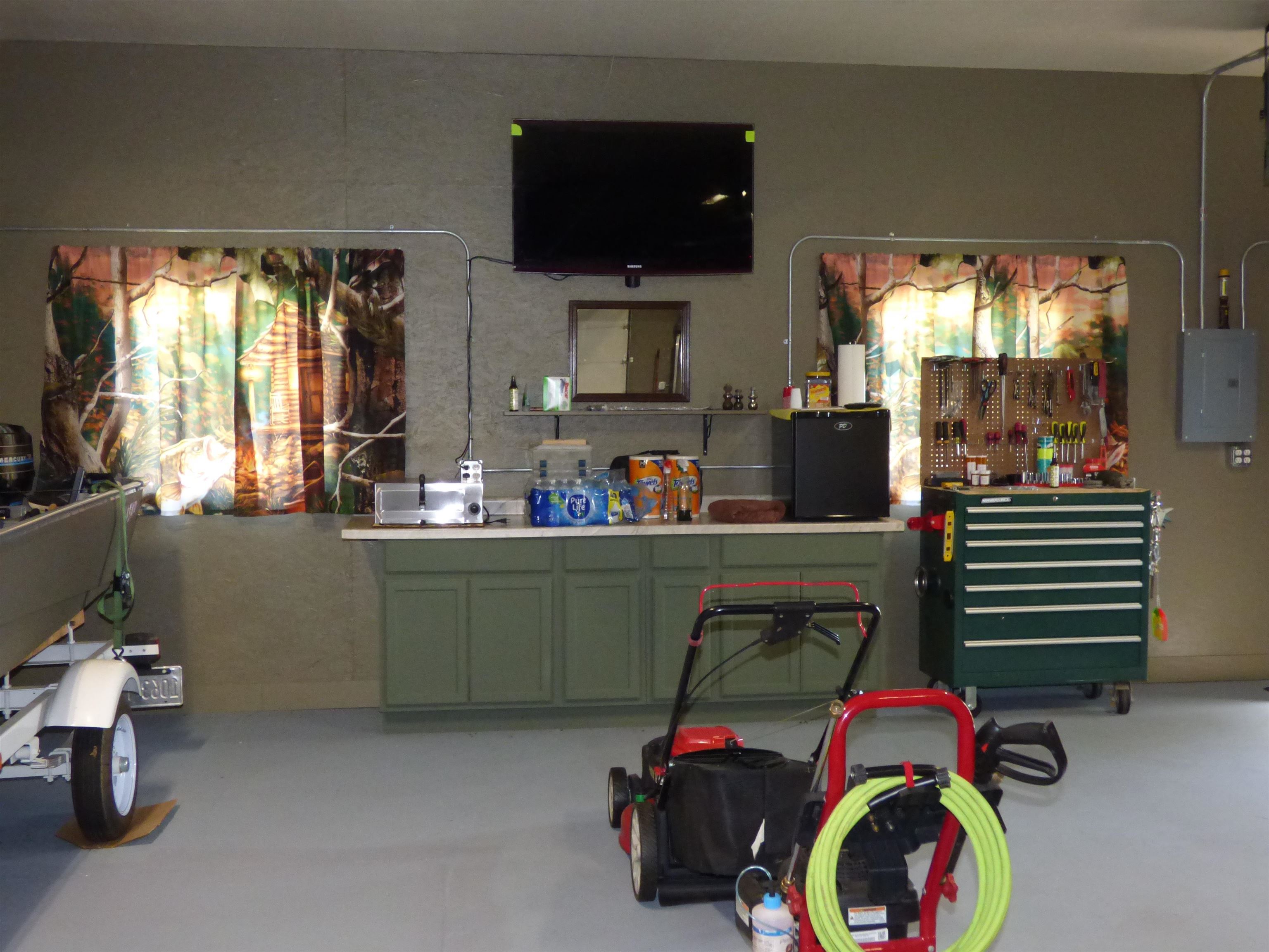 6384 A Diehl Road Savanna, IL 61074 - Photo 7 of 32 a room with furniture a flat screen tv and a window