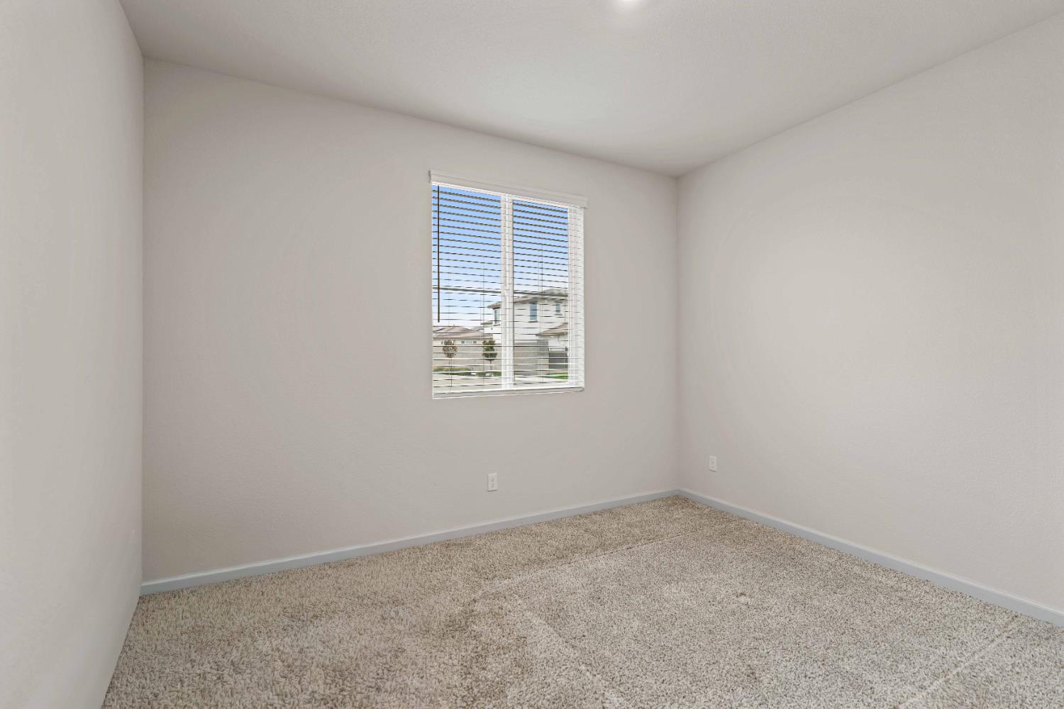 3095 Tower Street Manteca, CA 95337 - Photo 12 of 40 an empty room with windows